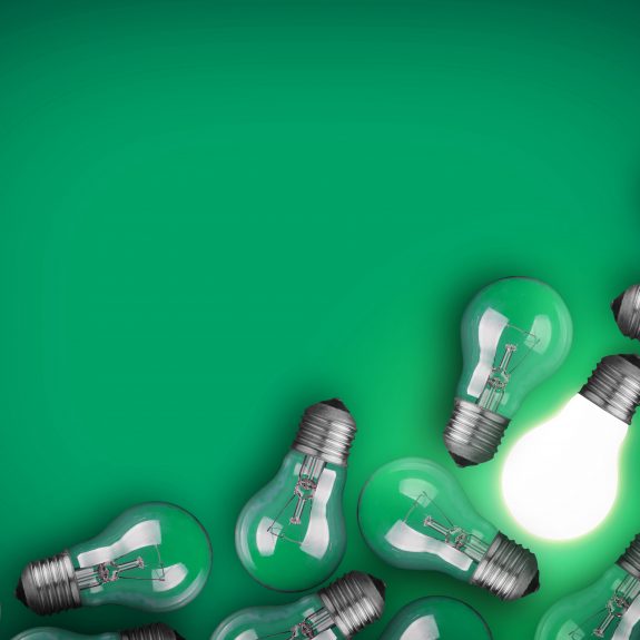 Lightbulbs On Green Background